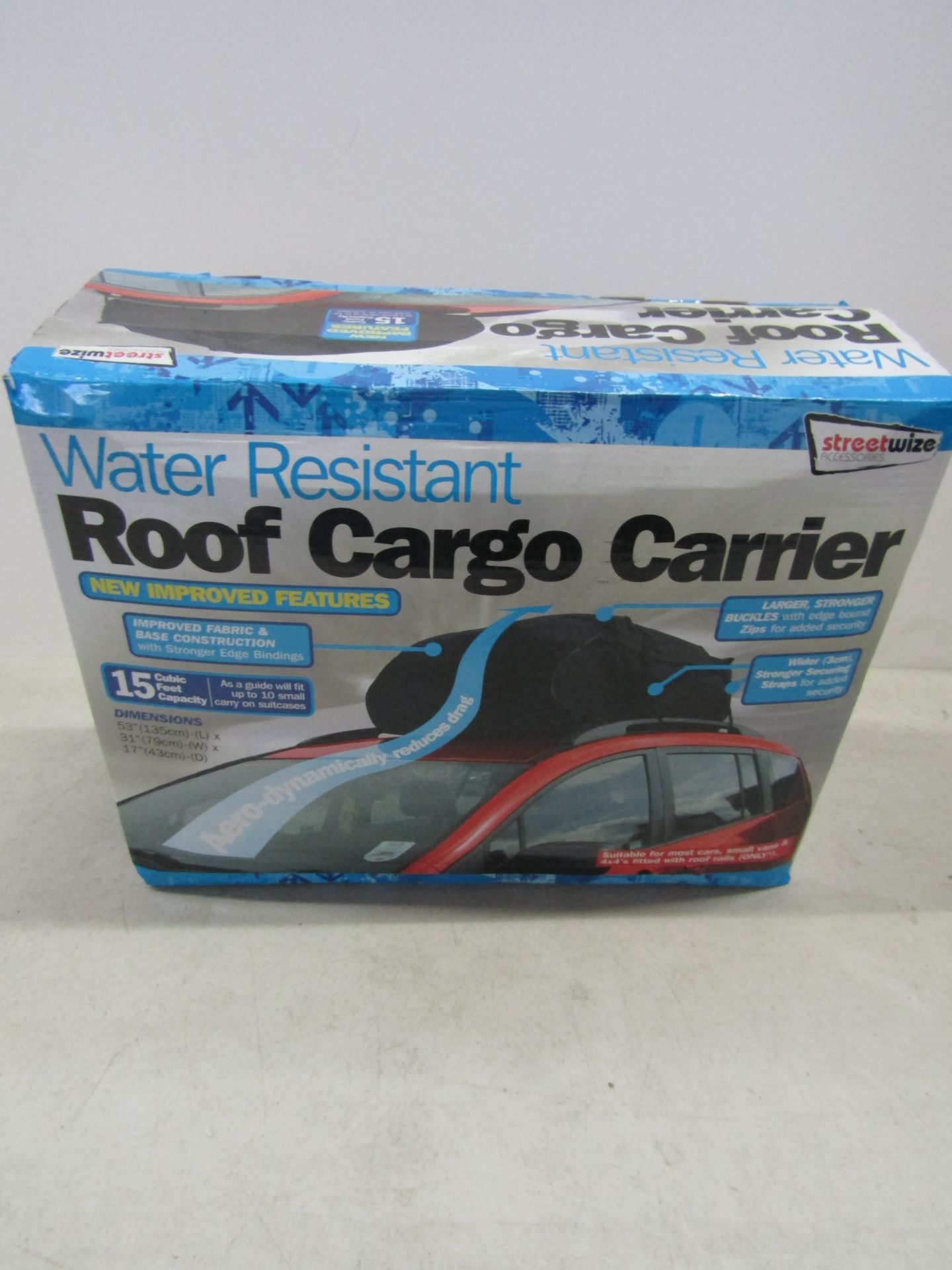 Water resistant roof cargo carrier, unused and boxed.