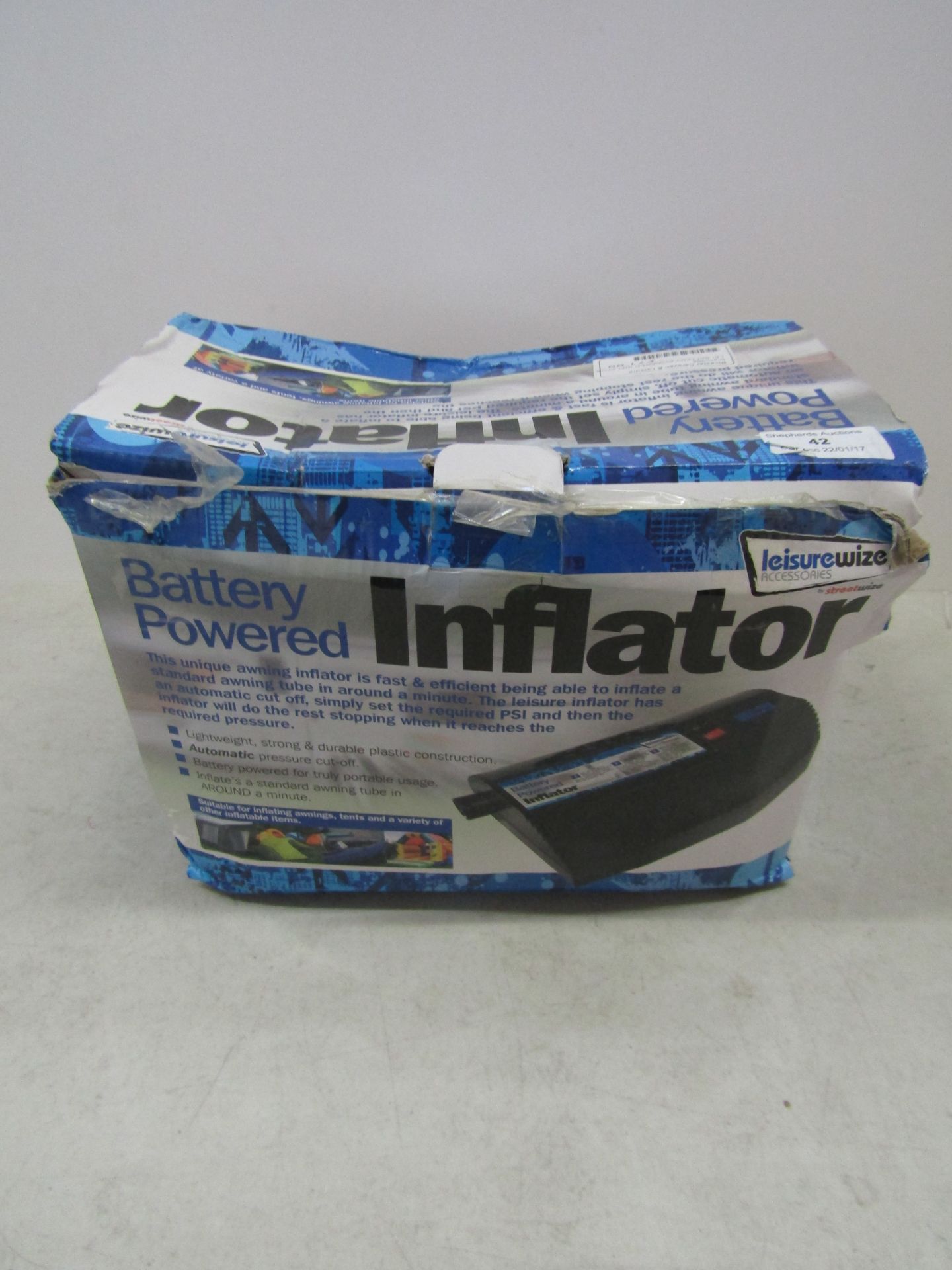 Battery powered inflator, unchecked and boxed.