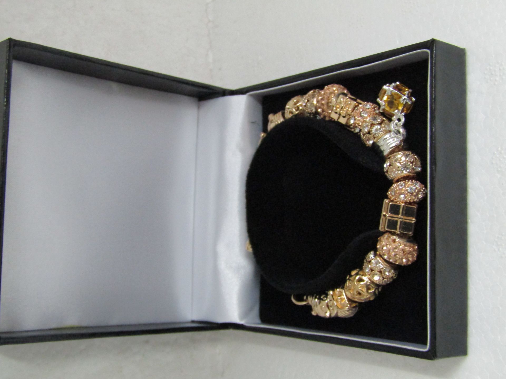 Fifth NYC Gold Plated Charm Bracelet with 17 Charms with  Swarovski Element Crystals in box