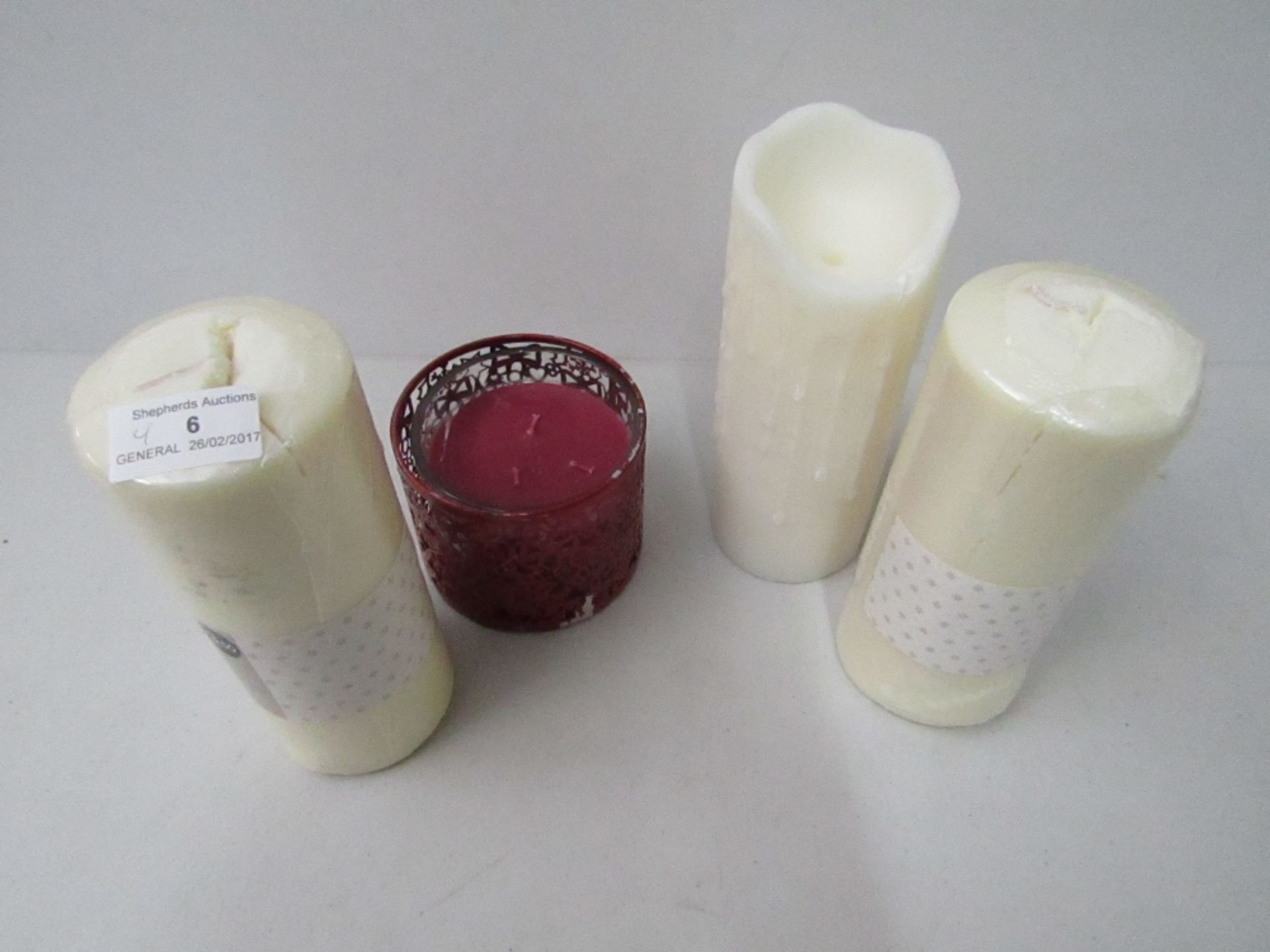 4 items being, 2x George home sweet vanilla scented pillar candles unchecked and in packaging,