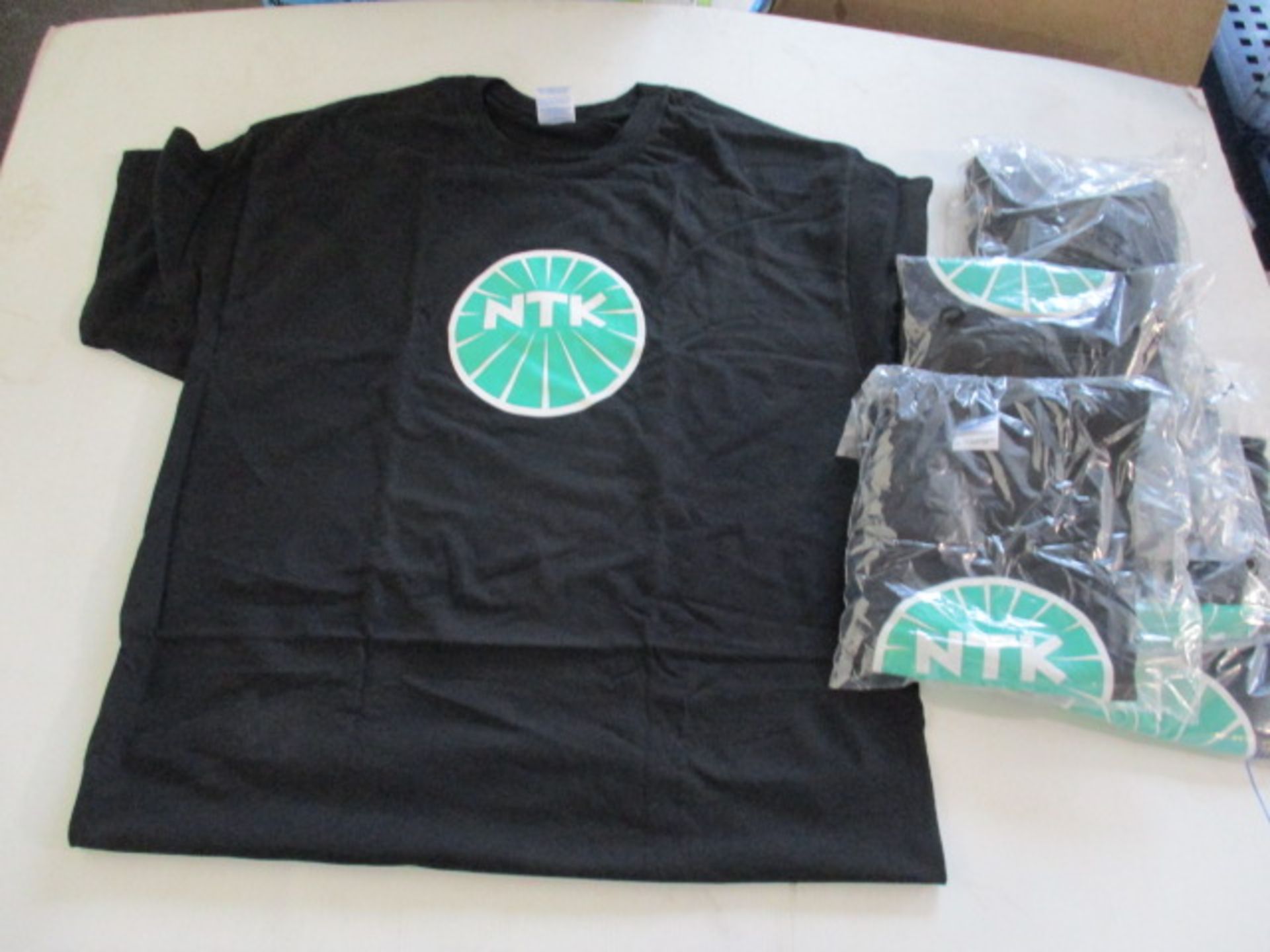 6 peices new and sealed NTK t shirt - assorted sizes