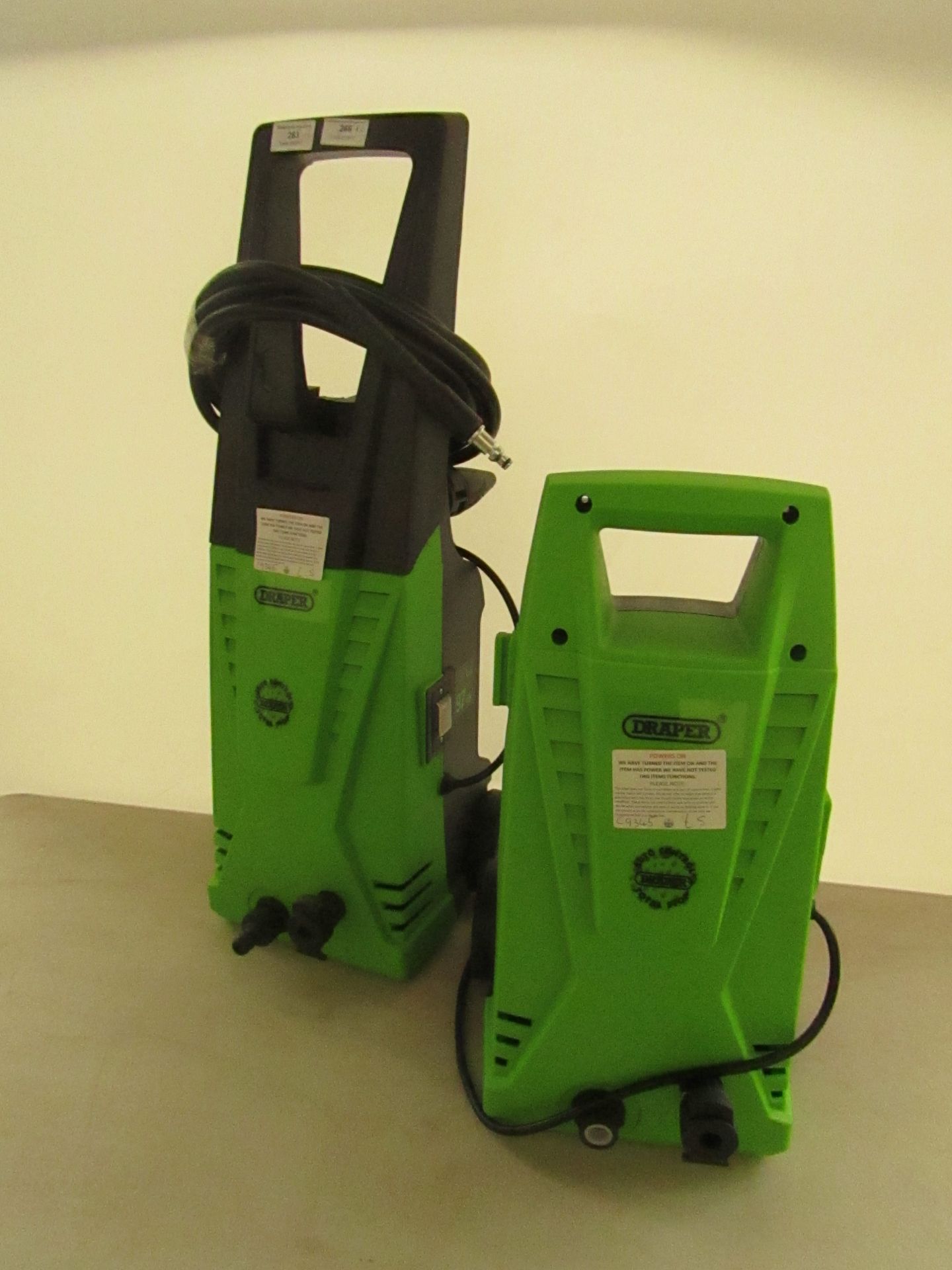 2x Draper pressure washers, both power on but missing various accessories.