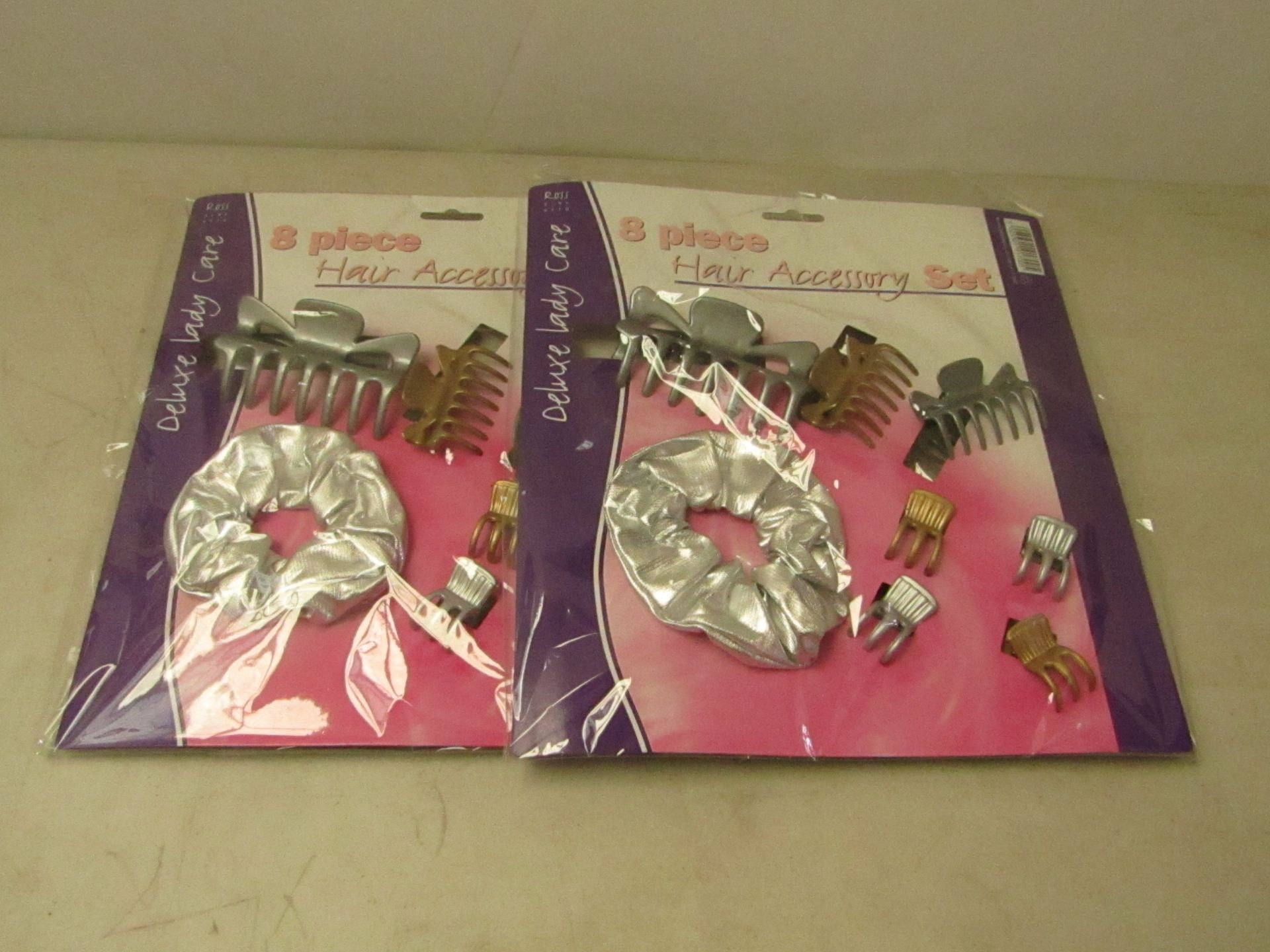 2x 8 Piece Hair Accessory Sets. All new in packaging.