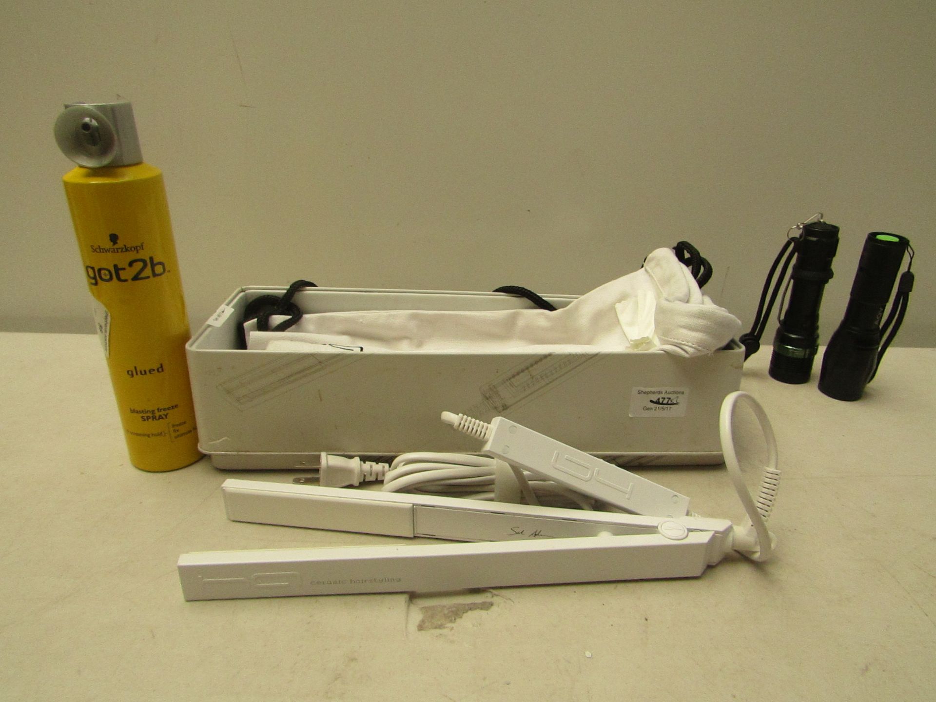 Hair set of hair straighteners and a 300ml can of Schwarzkopf got2b freeze sray.