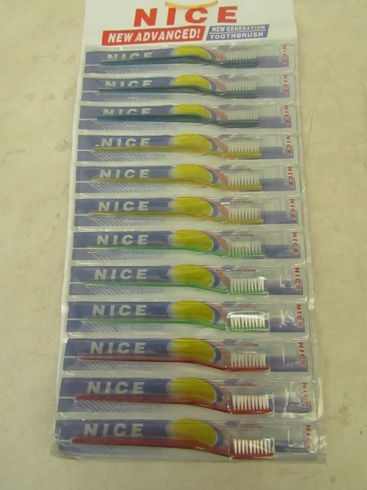 Approx 120x toothbrushes, new and factory sealed packaging.