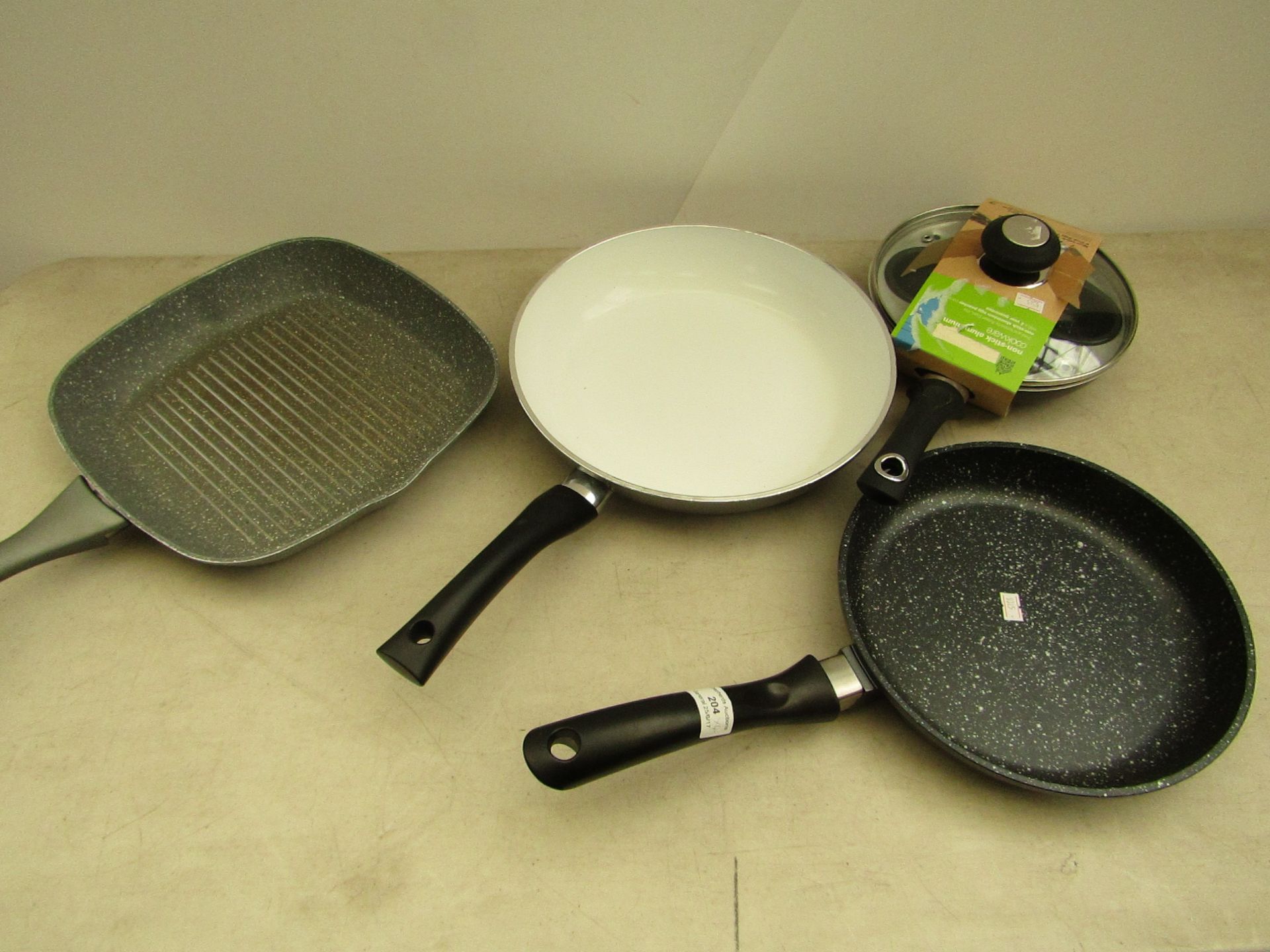 4 items being; 1x egg poacher, marble effect pan, ceramic pan, griller pan.