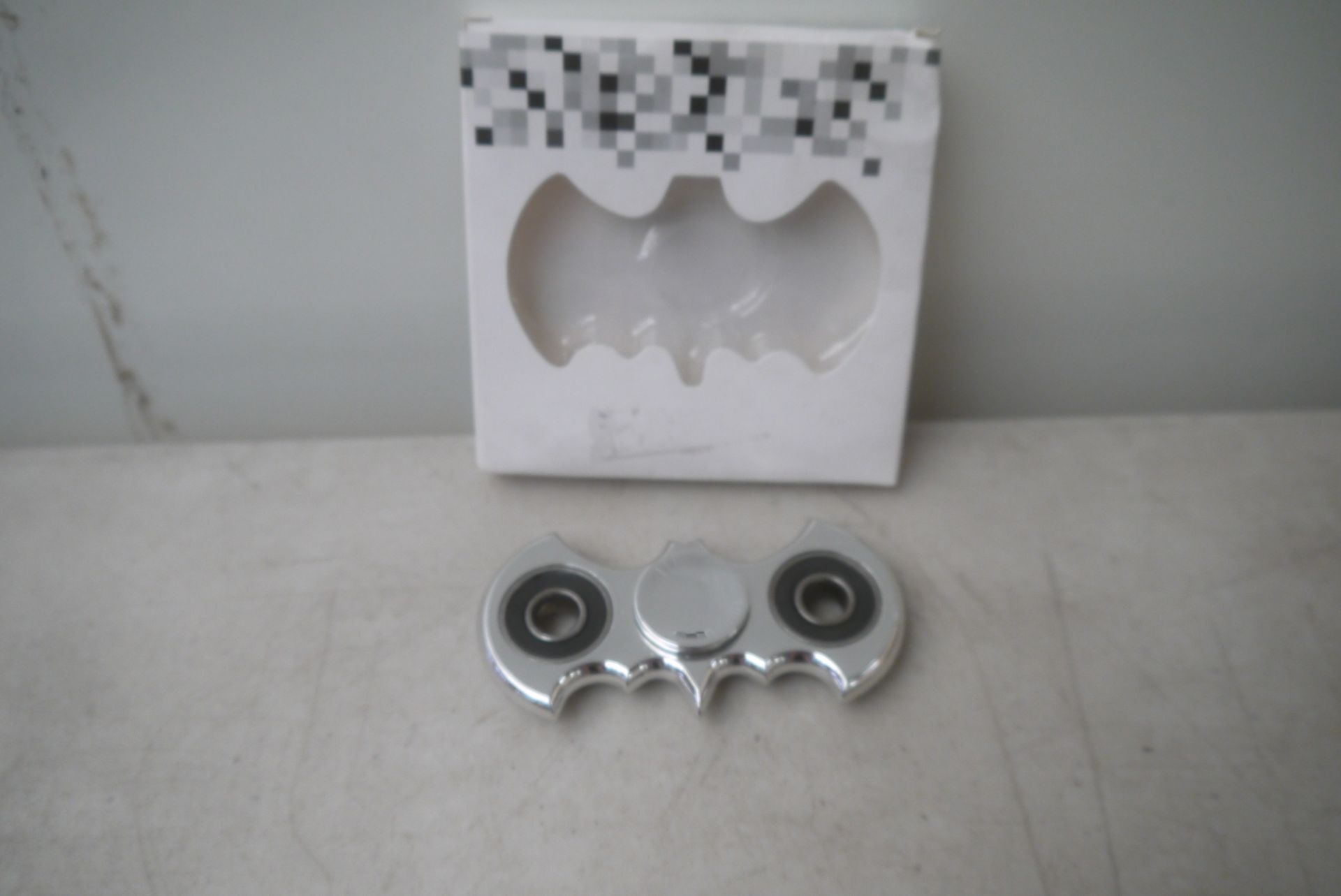 Chrome Batman designed fidget spinner, new and boxed.