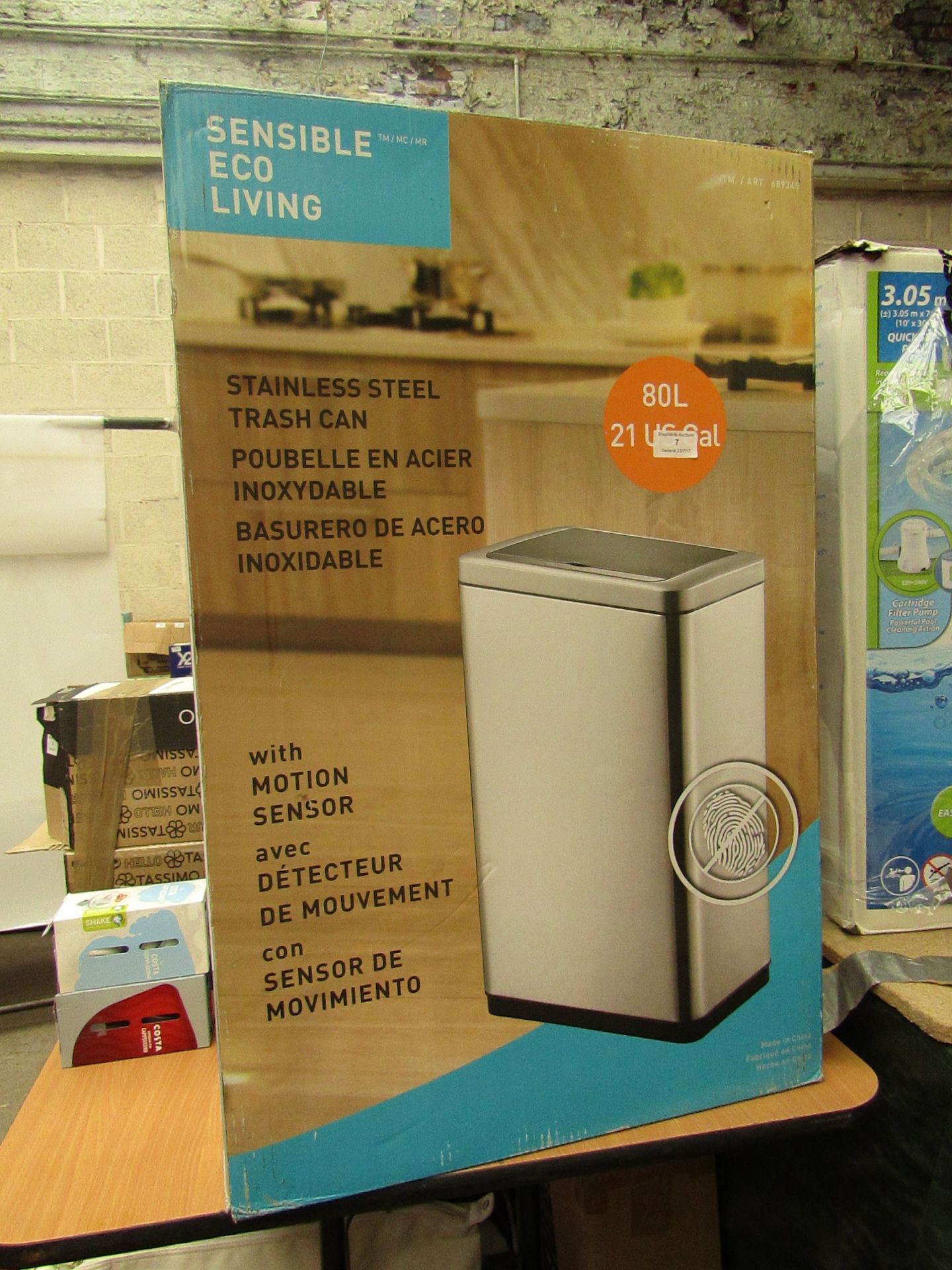 Sensible Eco Living stainless steel trash can with motion sensor, unchecked and boxed.