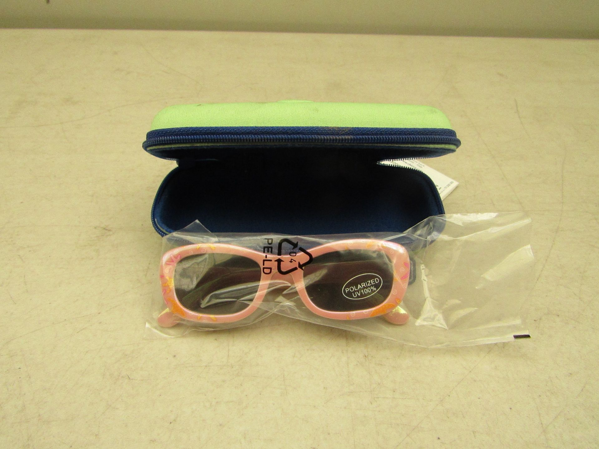 2x Chicco polarized UV 100% sunglasses, 24 months, both new in carry cases.