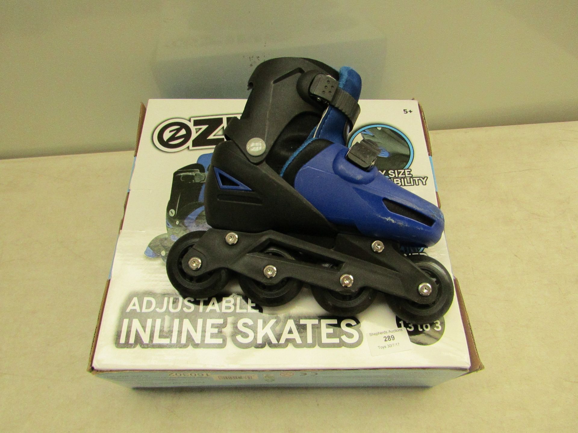 Ezinc adjustable inline skates, size 13 to 3, in packaging.