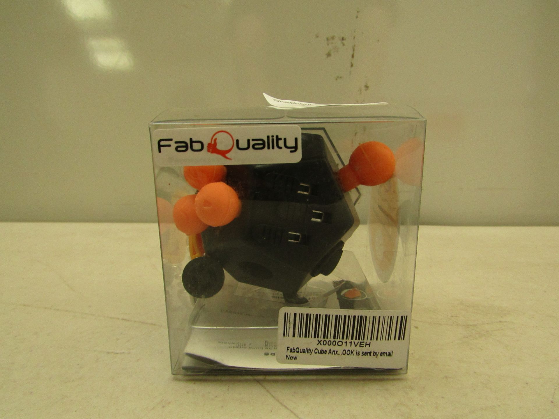 Fab Quality fidget cube, in packaging.