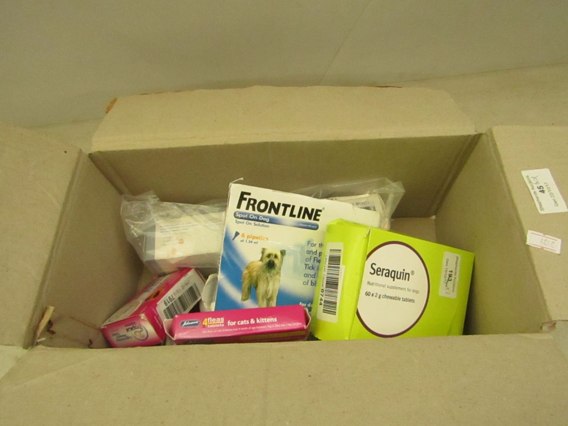 Box of 8x various pet medicines, such as flea killer tablets