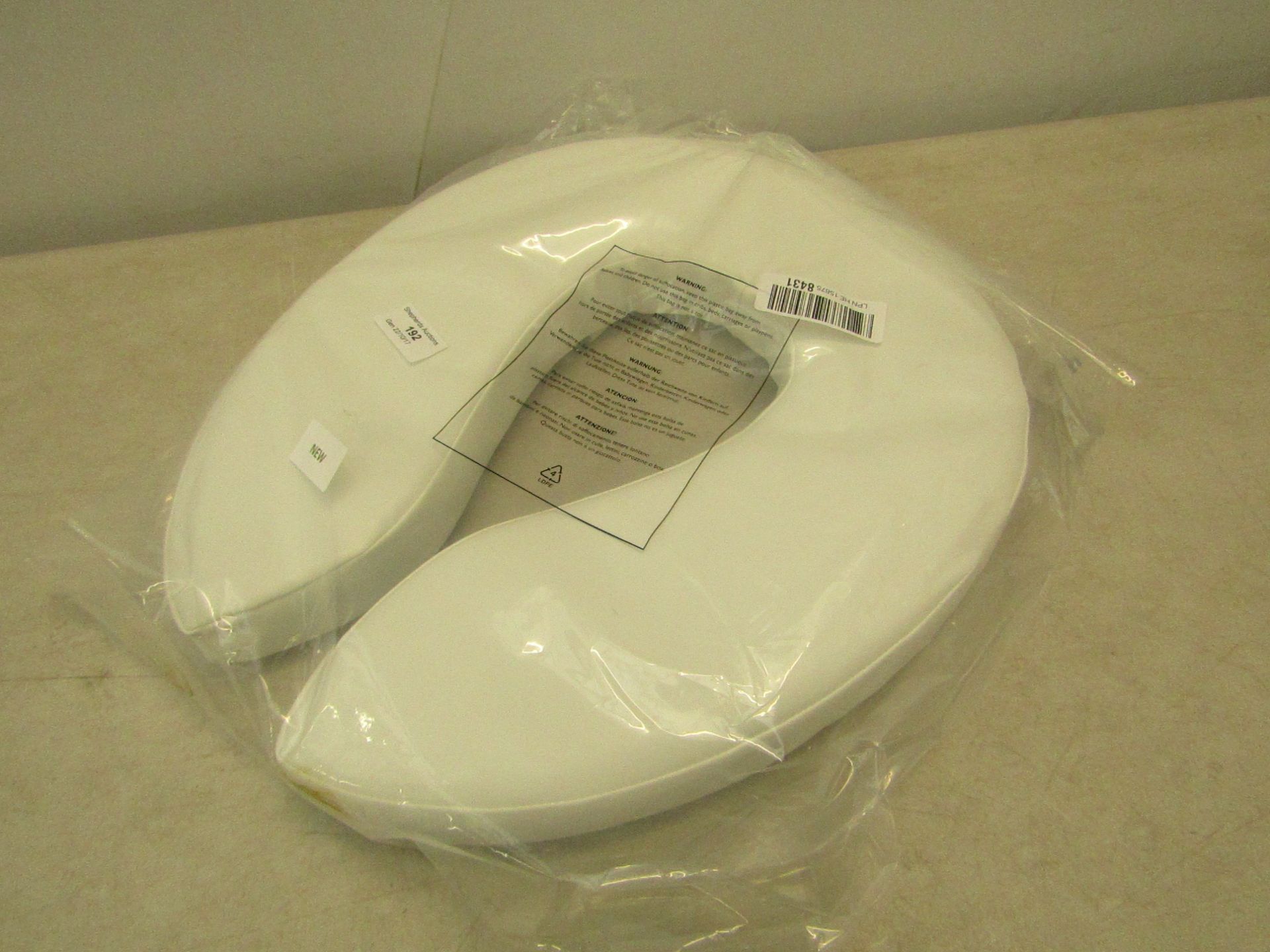 Seat cushion, new and packaged.