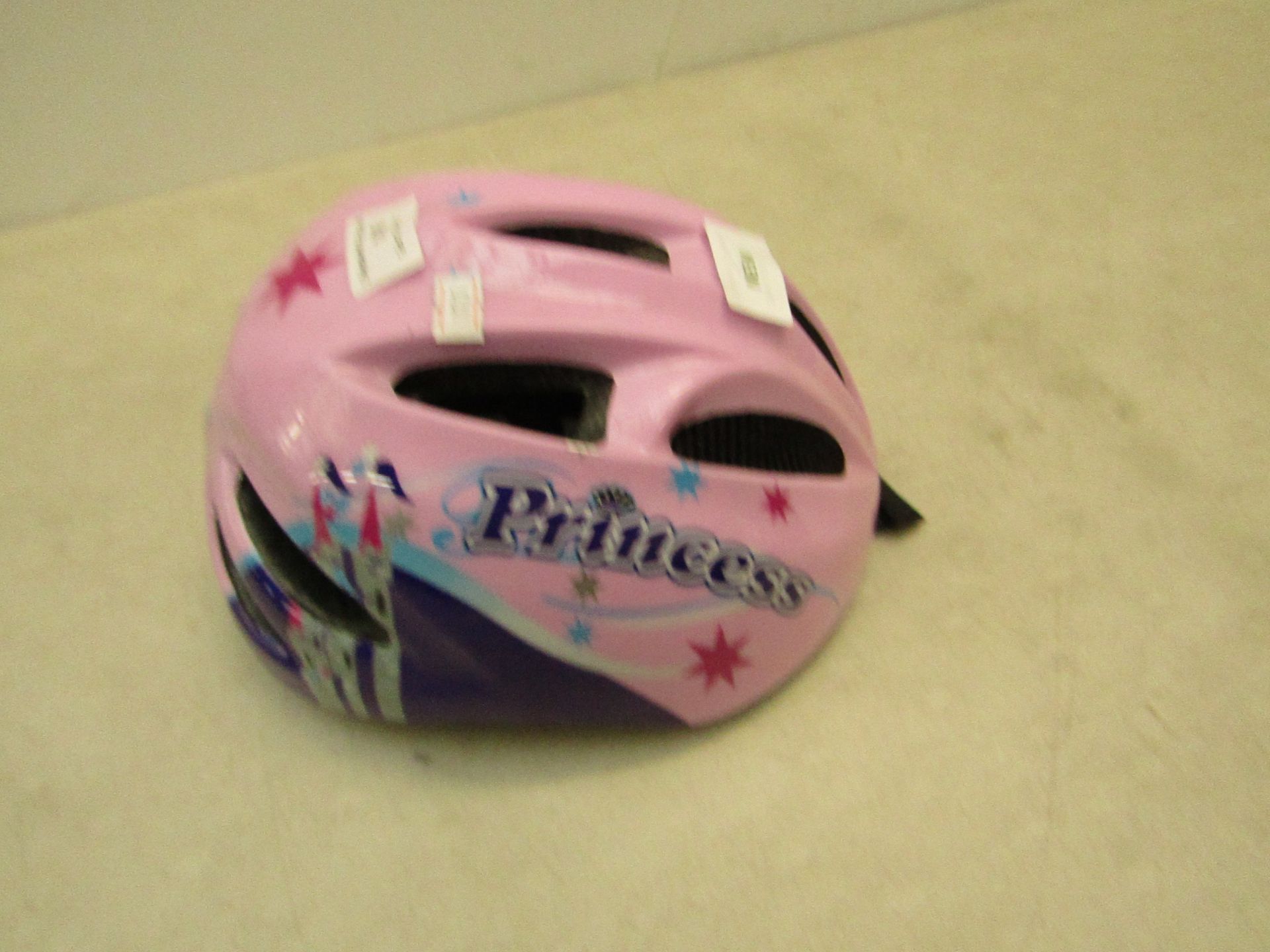 Princess pink coloured cycle helmet, new.