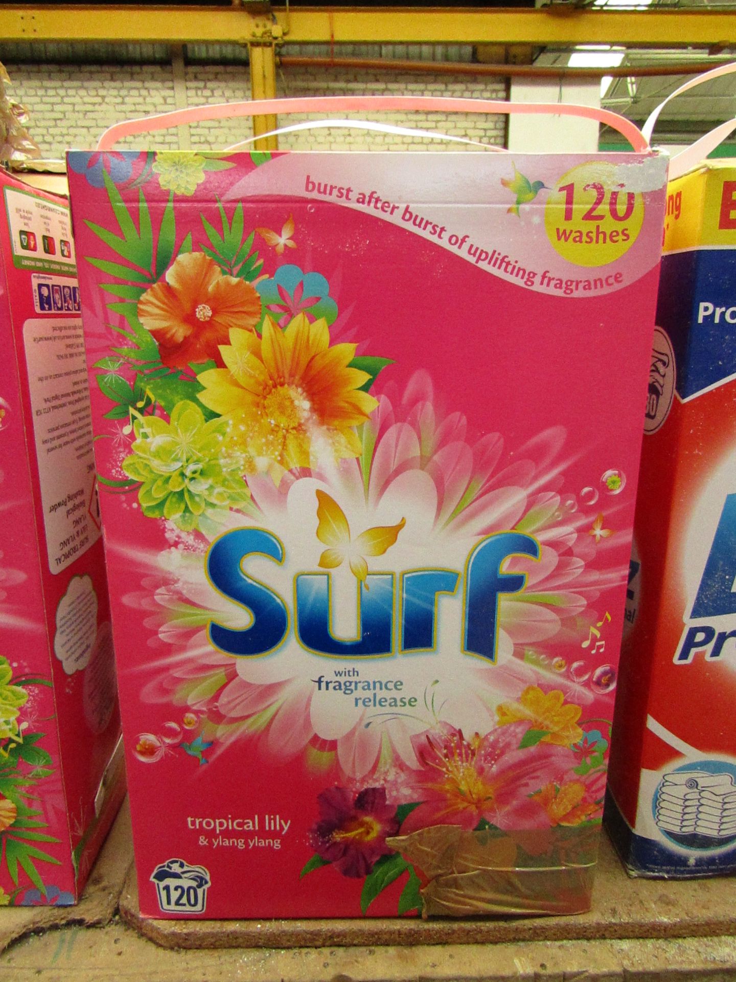 Surf tropical lily & ylang ylang washing powder, good for 120 washes. damaged Boxing.