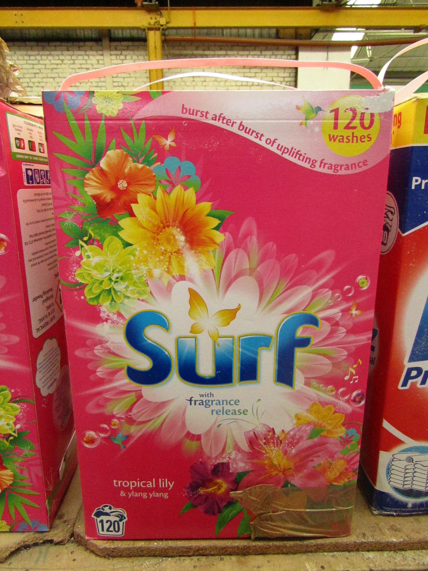 Surf tropical lily & ylang ylang washing powder, good for 120 washes. damaged Boxing.