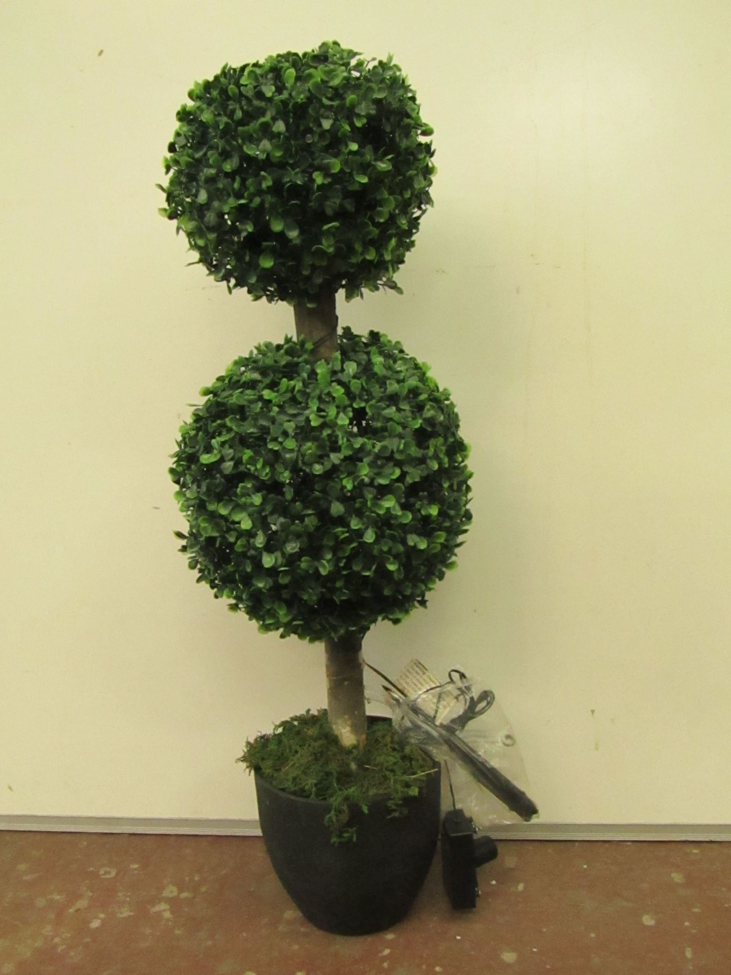 Artificial lit topiary bush, boxed. RRP circa £50 Please refer to lot 0 for important disclaimer.