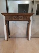 Wooden fire place surround with carved detail