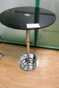 Bar table with black glass top and chrome base