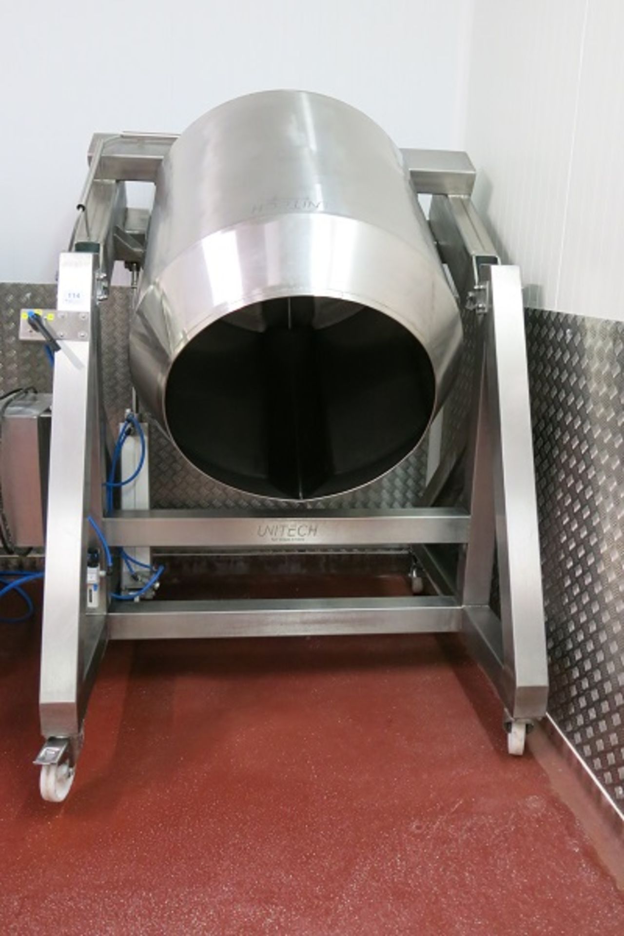 Unitech stainless steel tipping mixer - A lift out charge will apply