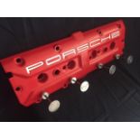 Porsche 928 rocker-cover coat hanger.