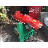 Child's arcade ride in the form of a 60's Ferrari