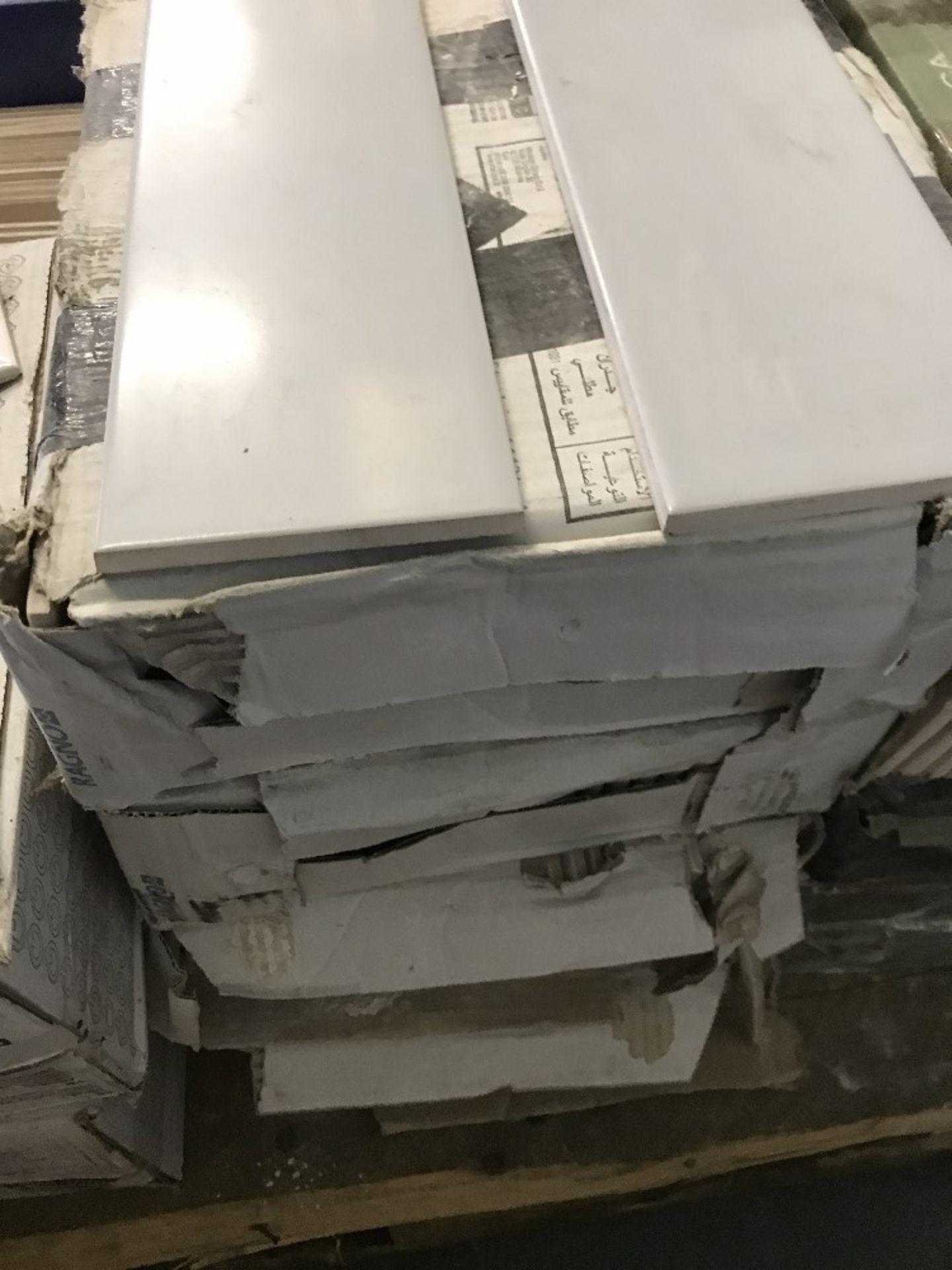 4 boxes of grey tiles