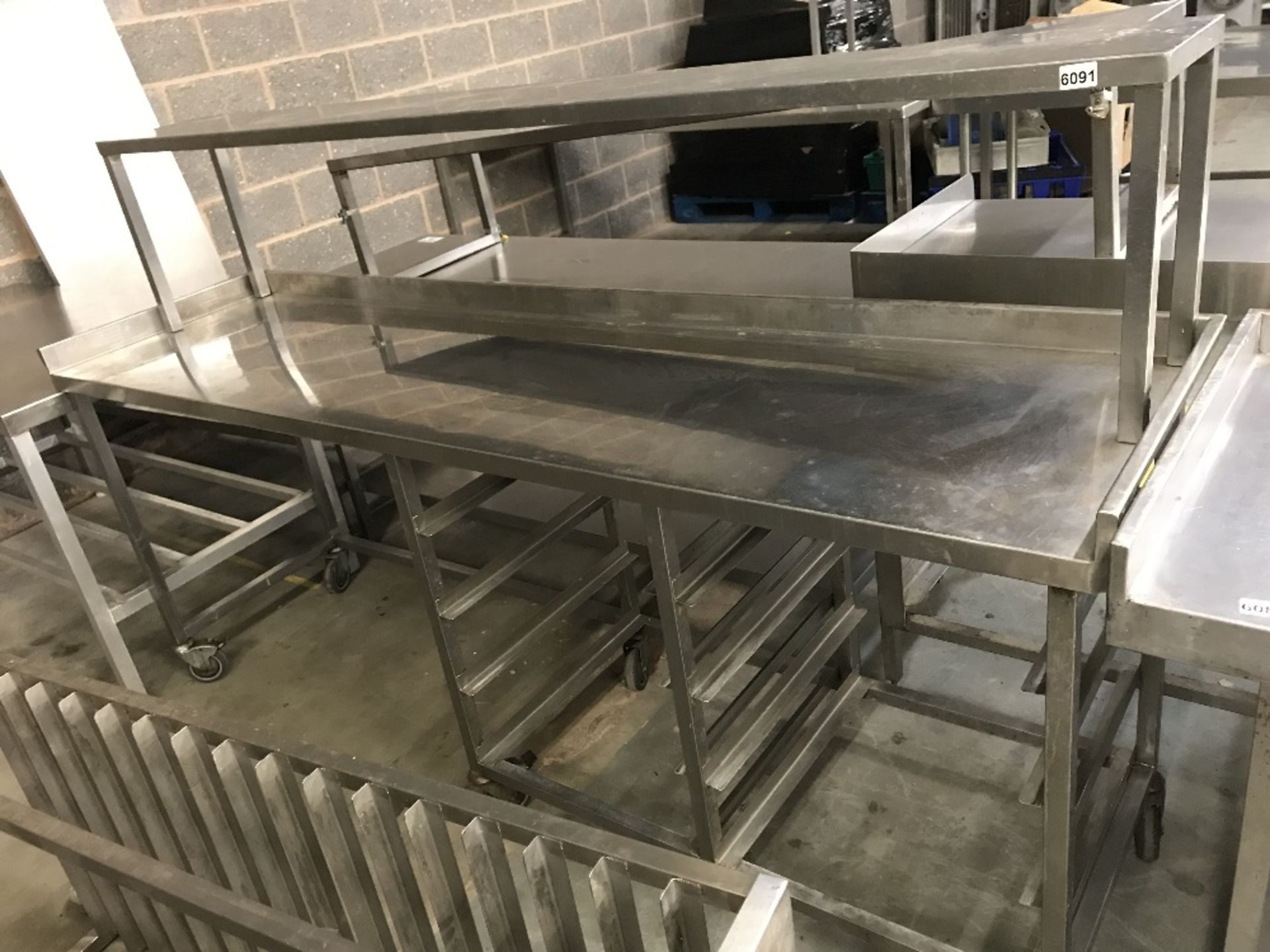 Large stainless steel wall prep bench with 10 tier rack and space for bins or appliances underneath,