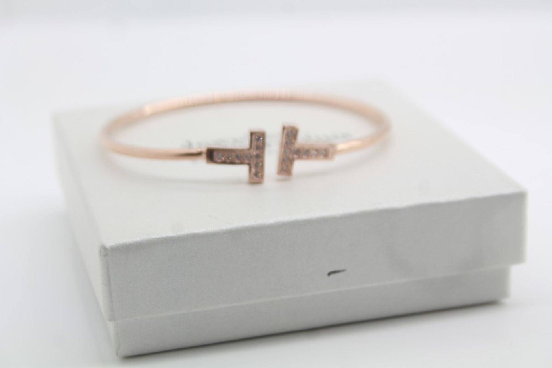 1 x BOXED BRAND NEW JEWELLERY BY CORNELIUS BANGLE, ROSE GOLD PLATED WITH CZ STONES, RRP-£90.00 *