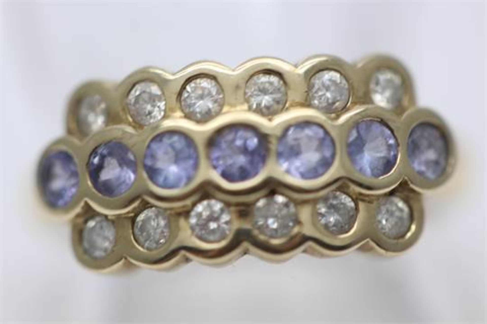 SOLID YELLOW GOLD VERY UNIQUE LADIES RING SET WITH 1.00 CARATS OF DIAMONDS AND TANZANITE (PV-JH)