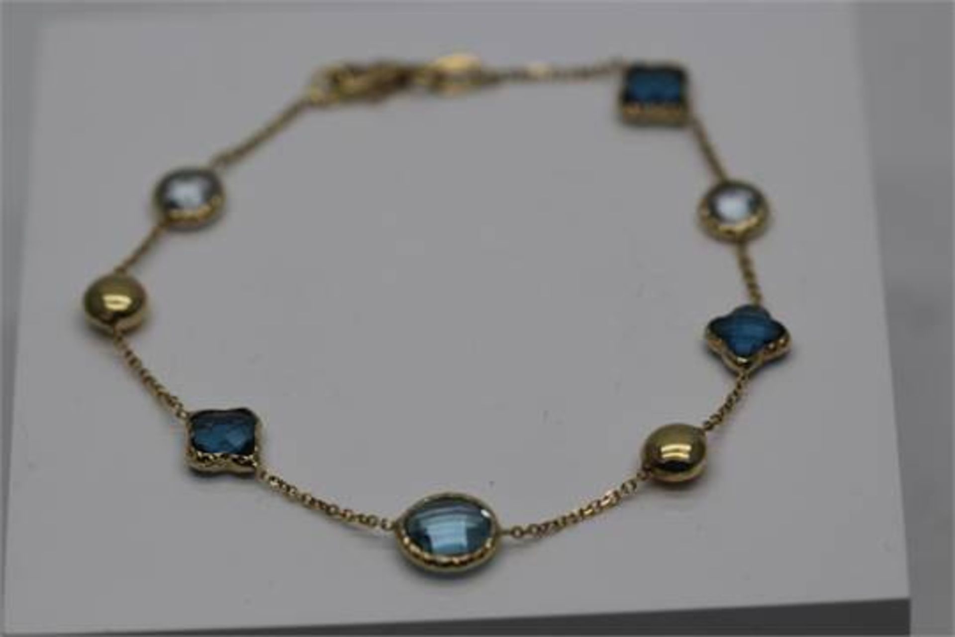 YELLOW GOLD LADIES BRACELET SET WITH APPROX 7.00 CARATS OF TOPAZ STONES (PV-JH)