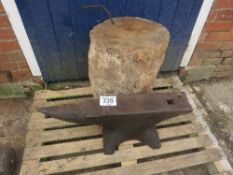 Anvil and wooden block stand