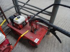 Petrol turf cutter