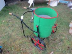 2-wheeled green/red metal water carrier