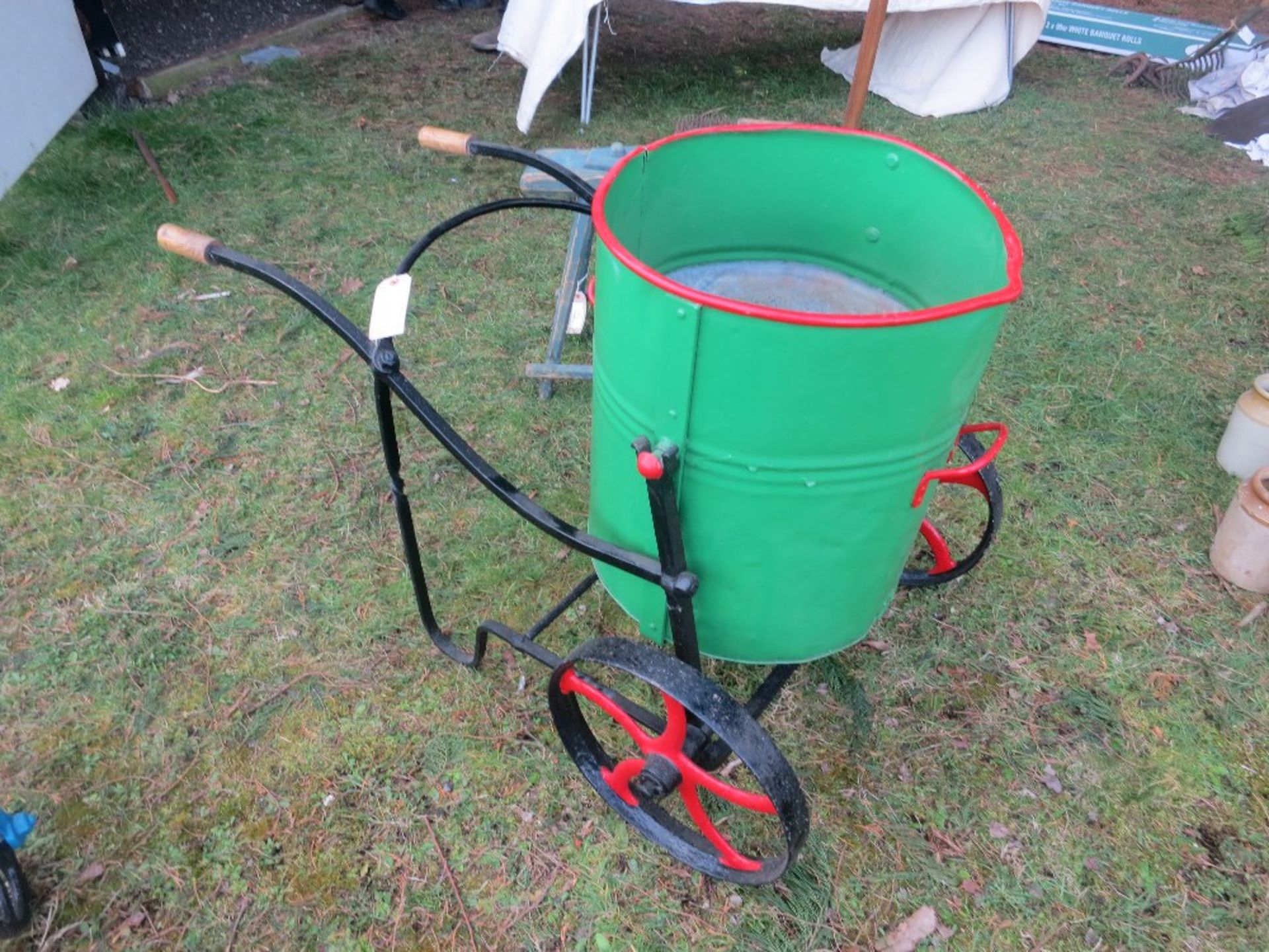 2-wheeled green/red metal water carrier