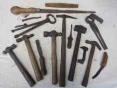 Box of assorted blacksmith's tools including hammers, grips etc. all in a Colemans Mustard wooden