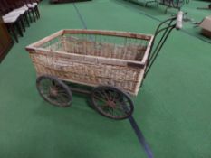 Old wicker four-wheeled trolley