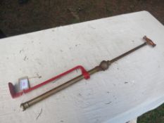 Brass stirrup pump inscribed Patent Four Oaks