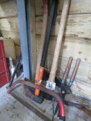 Assorted hand tools, pick axe, sledge hammer, bow saw etc
