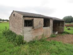 Sectional wooden stable building 12ft x 12ft approx with adjoining wooden open fronted shelter