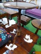 Mahogany pedestal wine table with turned column & scrolled supports, 14' diameter