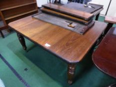 Mahogany wind-out dining table on turned tapered legs to castors plus 4x 9' wide leaves, 56.5'