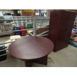 Suite of office furniture comprising circular table, tall 2 door cabinet, desk, low filing cabinet &