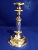 Single Sheffield plate candlestick, the neck of which needs repair. Height approx. 21cms