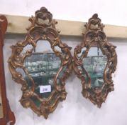 Pair of carved gilt wood, open scrolled work ornate wall mirrors, overall 25' x 15'