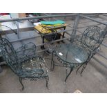 Iron work garden furniture of circular table with glass top, a chair & 2 armchairs