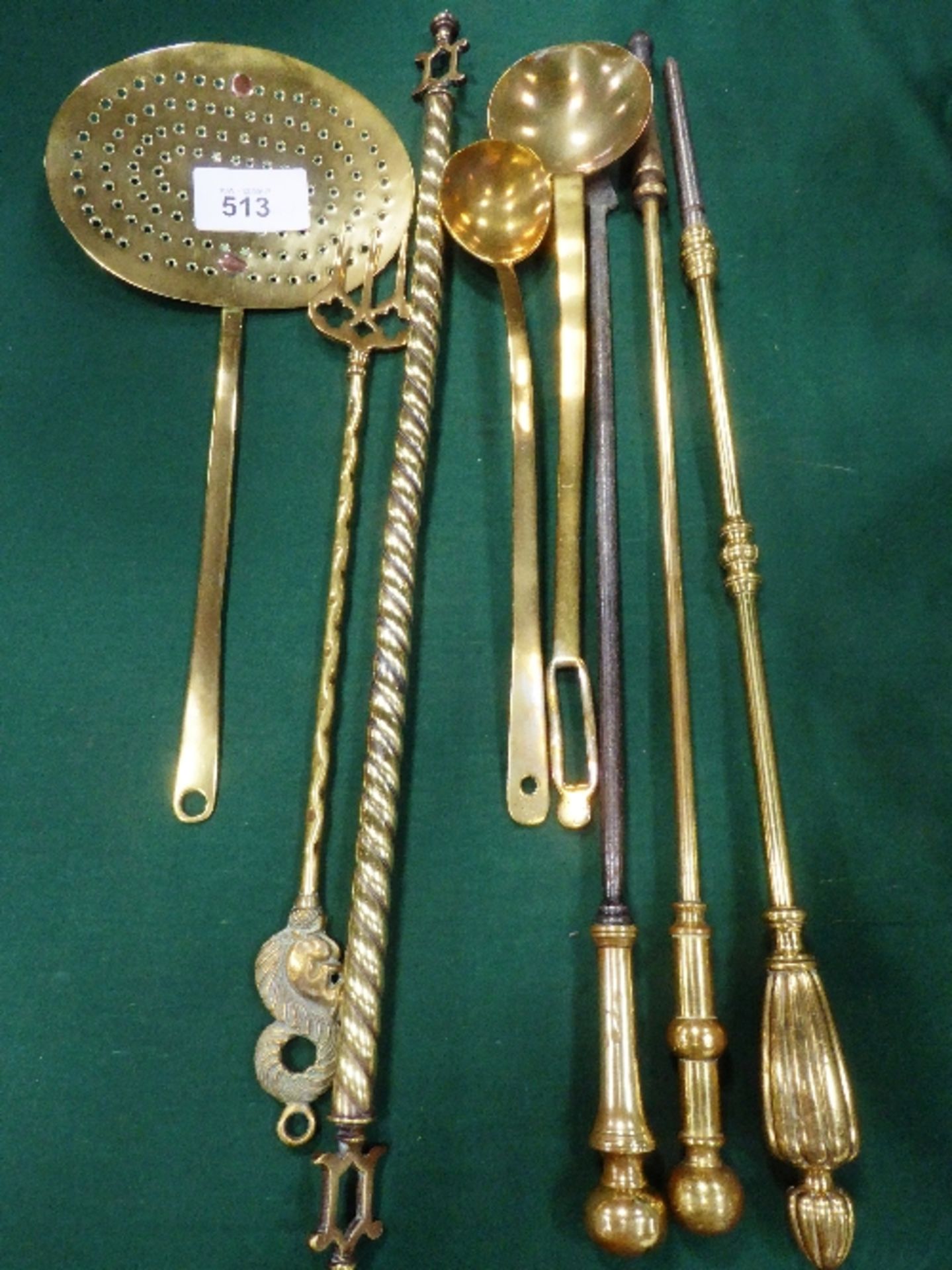 Brass chestnut roaster, toasting fork, 2 long spoons, 2 fire pokers & a brass twisted rail