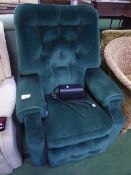 Dark green electric operated recliner armchair