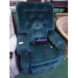 Dark green electric operated recliner armchair