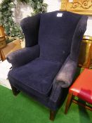 Blue upholstered wing back armchair